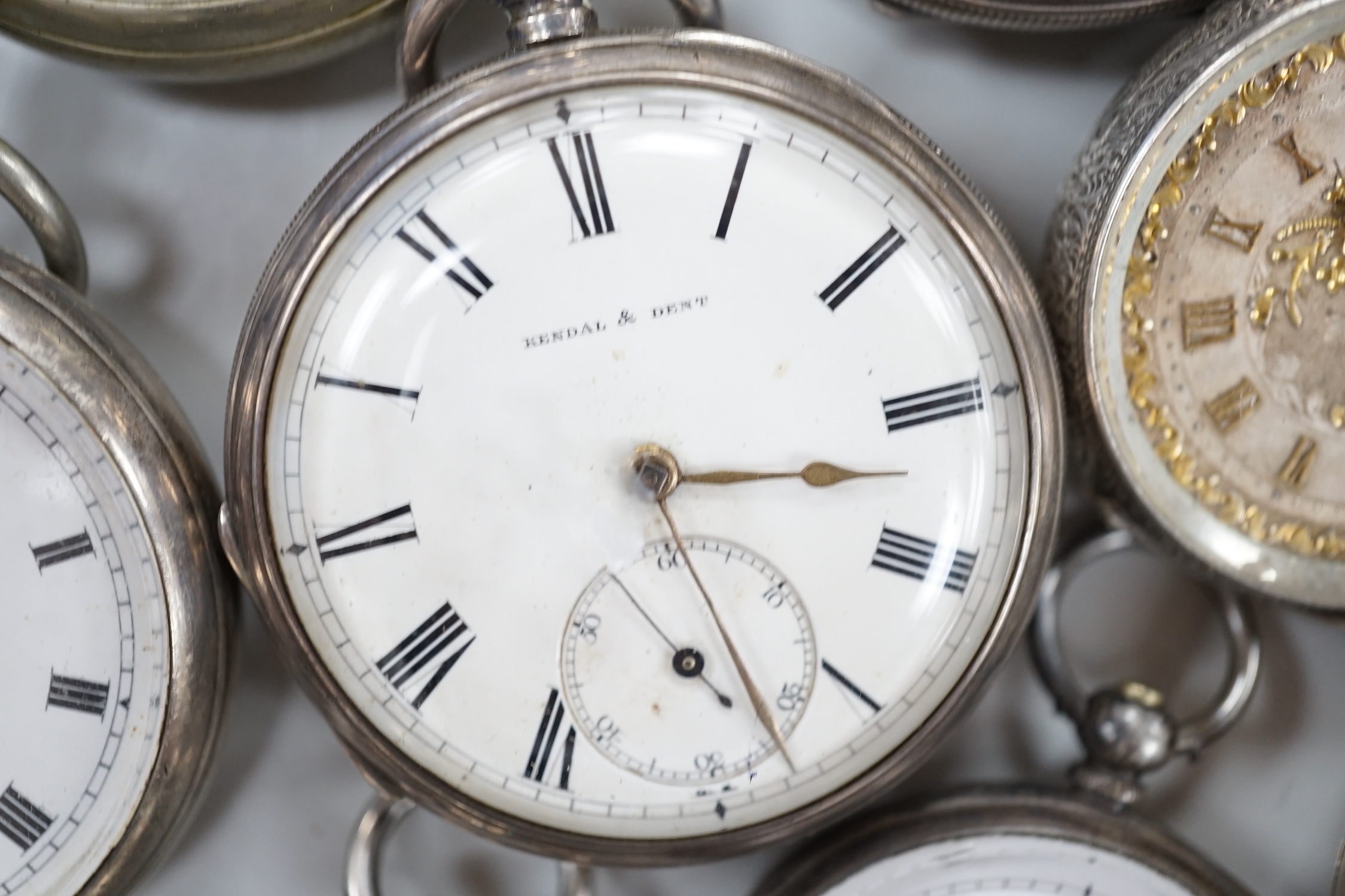 Thirteen assorted pocket and fob watches including silver Exchange and silver J.W. Benson.